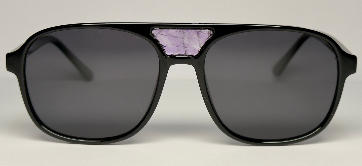 The "Karma" frames are nested with unique natural crystals. Black frames with Polarized sunglass lenses. Size: 54-16-145