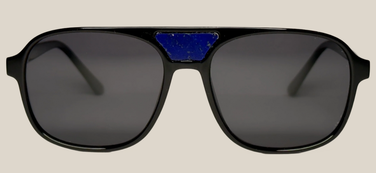 The "Karma" frames are nested with unique natural crystals. Black frames with Polarized sunglass lenses. Size: 54-16-145