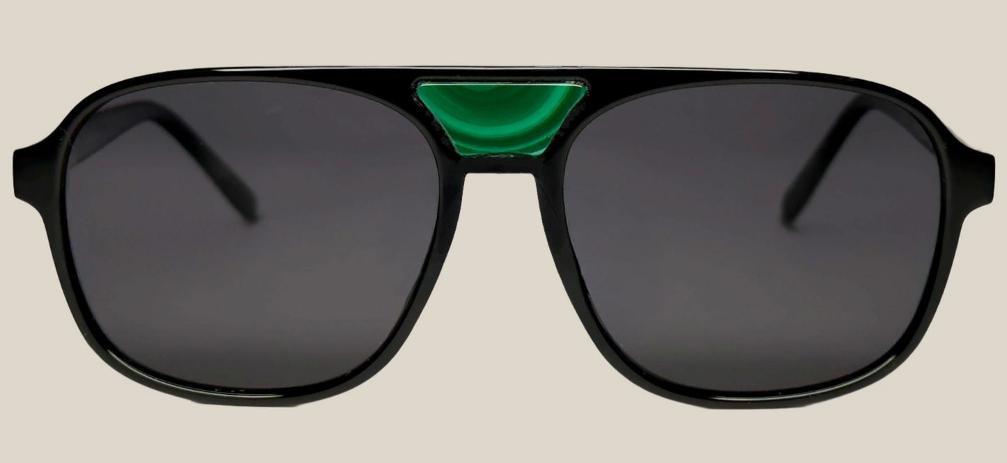 The "Karma" frames are nested with unique natural crystals. Black frames with Polarized sunglass lenses. Size: 54-16-145