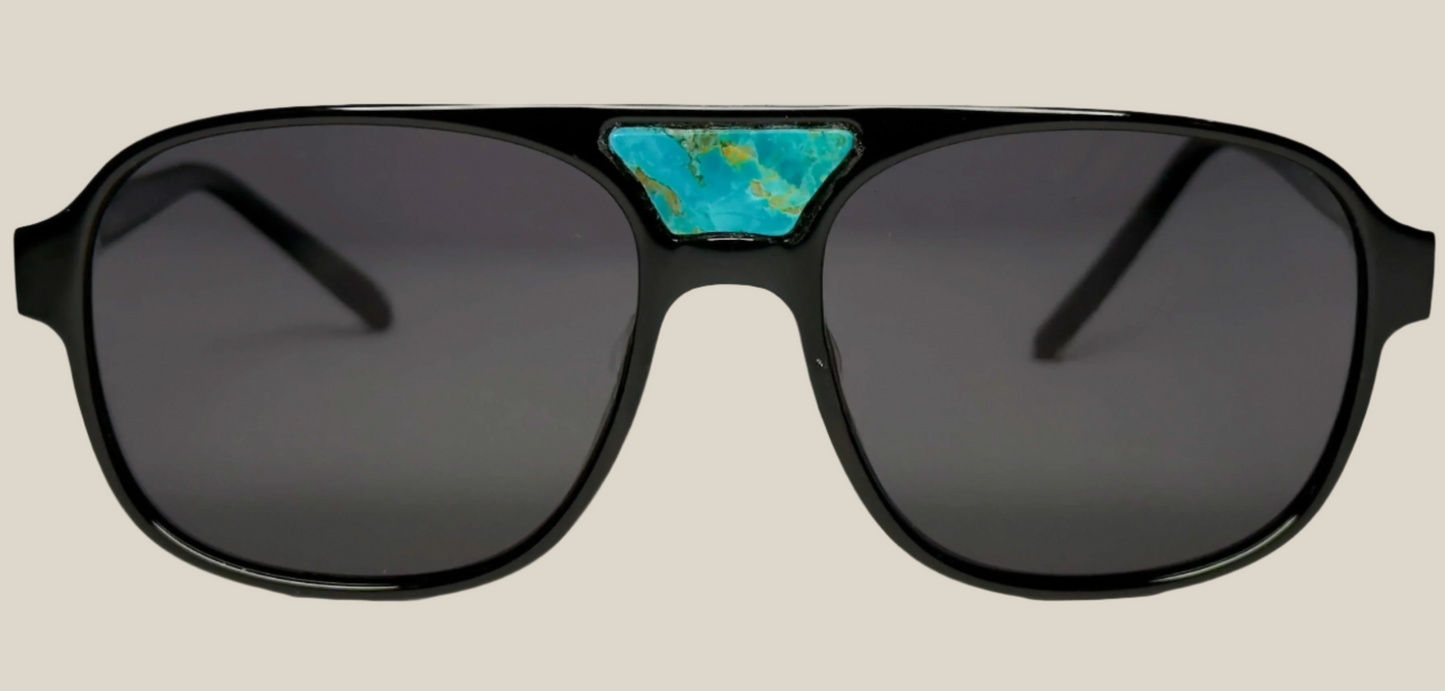 The "Karma" frames are nested with unique natural crystals. Black frames with Polarized sunglass lenses. Size: 54-16-145