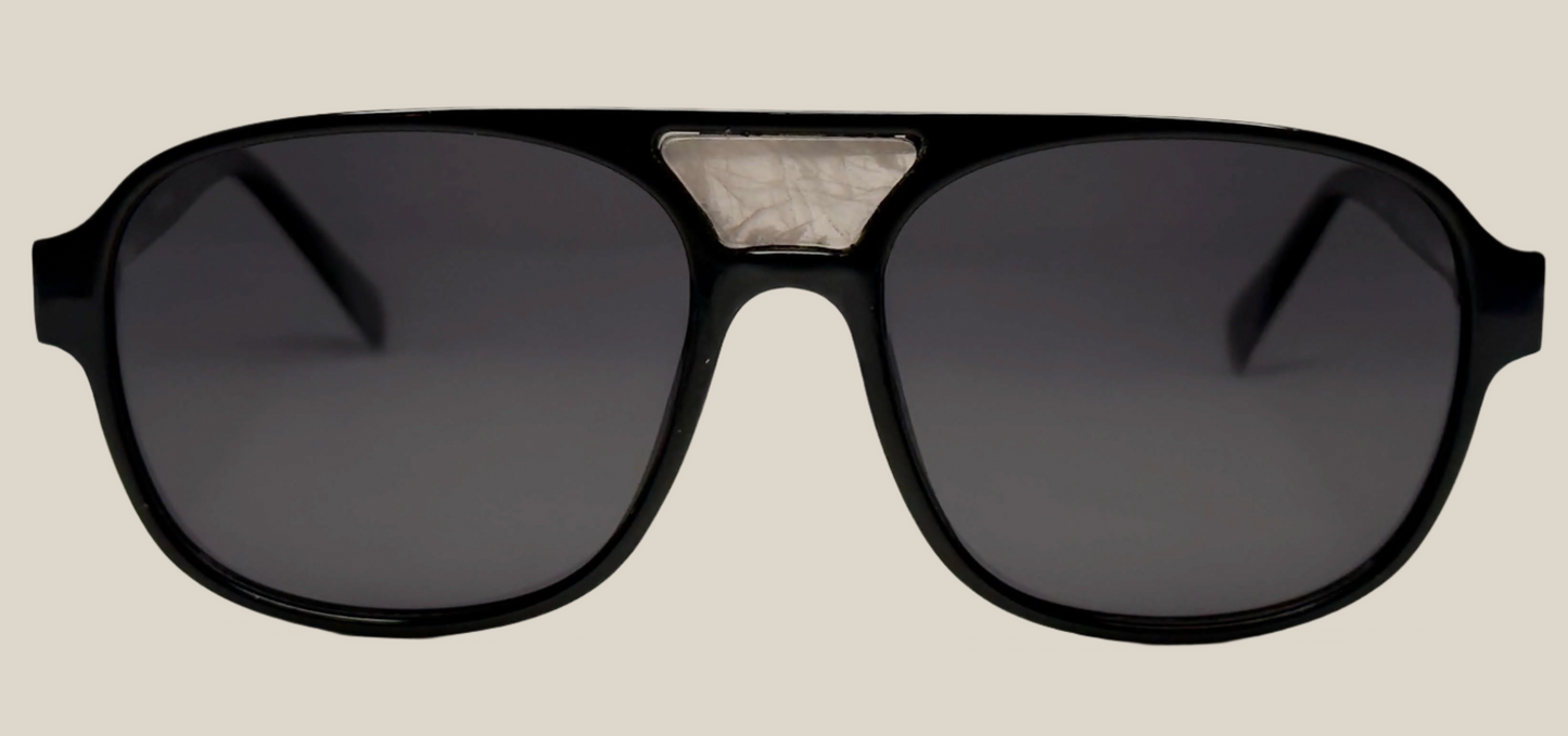 The "Karma" frames are nested with unique natural crystals. Black frames with Polarized sunglass lenses. Size: 54-16-145